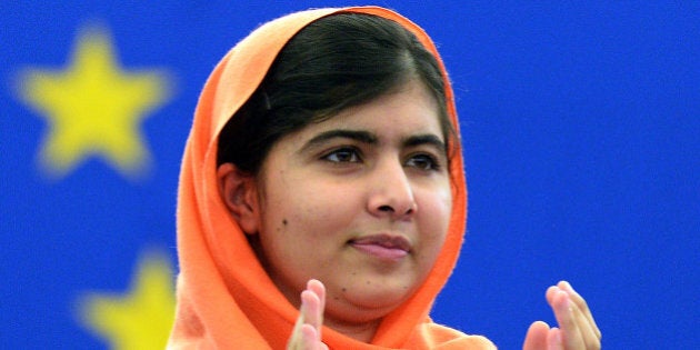 Malala Yousafzai, a Pakistani student who was shot in the head by the Pakistani Taliban applauds a speech after being awarded with the Sakharov Prize for Freedom of Thought, on November 20, 2013 at the European Parliament in Strasbourg, eastern France. The Sakharov Prize , named after Soviet scientist and dissident Andrei Sakharov, was established by the European Parliament as a means to honour individuals or organisations who have dedicated their lives to the defence of human rights and freedom of thought. AFP PHOTO/ PATRICK HERTZOG (Photo credit should read PATRICK HERTZOG/AFP/Getty Images)