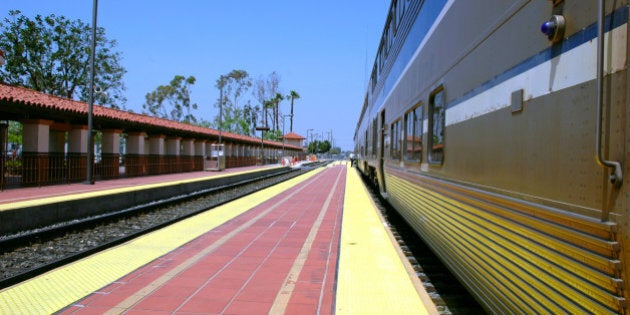 train stopped along a platform...