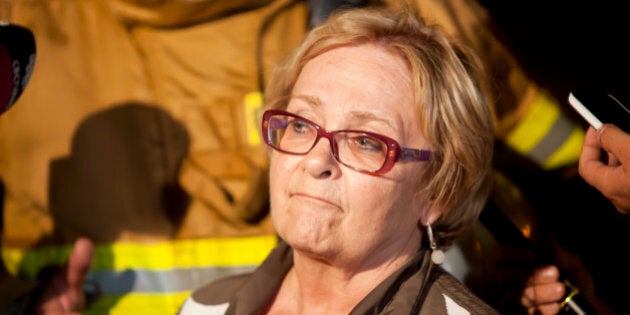 Colette Roy-Laroche, mayor of Lac-Mégantic, speaks during a press conference after a freight train loaded with oil derailed in Lac-Megantic in Canada's Quebec province on July 6, 2013, sparking explosions that engulfed about 30 buildings in fire. At least 80 people are missing after a driverless oil tanker train derailed and exploded in the small Canadian town of Lac-Megantic, destroying dozens of buildings, a firefighter back from the scene told AFP. AFP PHOTO / François Laplante-Delagrave (Photo credit should read François Laplante-Delagrave/AFP/Getty Images)