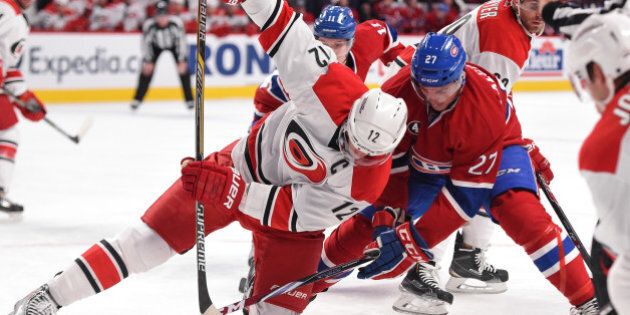 MONTREAL, QC - DECEMBER 16: Alex Galchenyuk #27 of the Montreal Canadiens faces off against Eric Staal #12 of the Carolina Hurricanes in the NHL game at the Bell Centre on December 16, 2014 in Montreal, Quebec, Canada. (Photo by Francois Lacasse/NHLI via Getty Images)