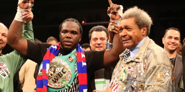 LOS ANGELES, CA - MAY 10: Bermane Stiverne and promoter Don King pose for photos after Stiverne defeated Chris Arreola in their WBC Heavyweight Championship match at Galen Center on May 10, 2014 in Los Angeles, California. Stiverne won in a six round technical knockout. (Photo by Stephen Dunn/Getty Images)