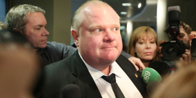 TORONTO, ON- MARCH 4 - Mayor Rob Ford tries to put a positive spin on his performance the day after his appearence on the Jimmy Kimmel Show as he arrives at City Hall In Toronto. March 4, 2014. (Steve Russell/Toronto Star via Getty Images)