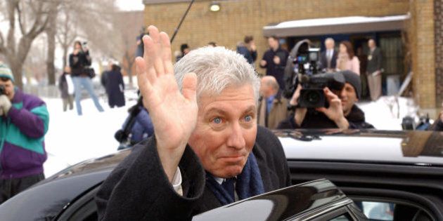 Montreal, CANADA: Gilles Duceppe, head of the Bloc Quebecois political party in Quebec, waves after voting early 23 January 2006 in Montreal in the Canadian federal election. Canadians appeared headed for a new era of right-wing rule, voting in an election tipped to end the Liberal Party's 12-year reign and produce a Conservative-led minority government. Stephen Harper, the 46-year-old Conservative leader, is pledging to flush away political scandals tainting Prime Minister Paul Martin's centrist Liberals and mend strained relations with the United States. AFP PHOTO/Steeve DUGUAY (Photo credit should read STEEVE DUGUAY/AFP/Getty Images)