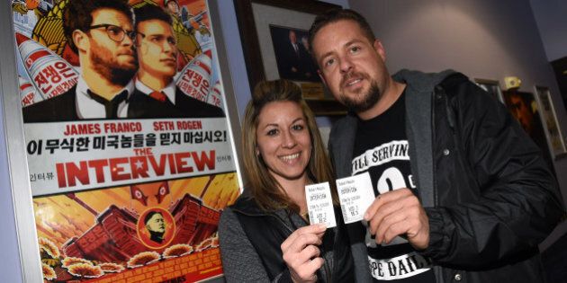 MESQUITE, NV - DECEMBER 25: Melissa DeVarona (L) and Dana Canfield of Nevada hold their tickets on Christmas Day to see Sony Pictures' 'The Interview' at the Megaplex Theatres - Stadium 6 on December 25, 2014 in Mesquite, Nevada. DeVarona and Canfield drove 80 miles from Las Vegas, Nevada to see the movie that opened on Christmas Day after Sony hackers released stolen information and threatened attacks on theaters that screen the film. (Photo by Ethan Miller/Getty Images)