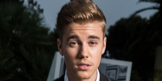 CAP D'ANTIBES, FRANCE - MAY 22: Justin Bieber poses for a portrait at amfAR's 21st Cinema Against AIDS Gala Presented By WORLDVIEW, BOLD FILMS, And BVLGARI at Hotel du Cap-Eden-Roc on May 22, 2014 in Cap d'Antibes, France. (Photo by Pascal Le Segretain/amfAR14/WireImage)