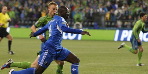 SEATTLE, WA - MARCH 02: Andy Rose #25, of the Seattle Sounders, chases Hassoun Camara #6, of Montreal Impact, in the first half at CenturyLink Field on March 2, 2013 in Seattle, Washington. (Photo by Kevin Casey/Getty Images)