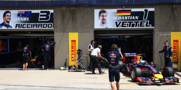 MONTREAL, QC - JUNE 07: Sebastian Vettel of Germany and Infiniti Red Bull Racing drives out of the team garage during qualifying ahead of the Canadian Formula One Grand Prix at Circuit Gilles Villeneuve on June 7, 2014 in Montreal, Canada. (Photo by Mark Thompson/Getty Images)