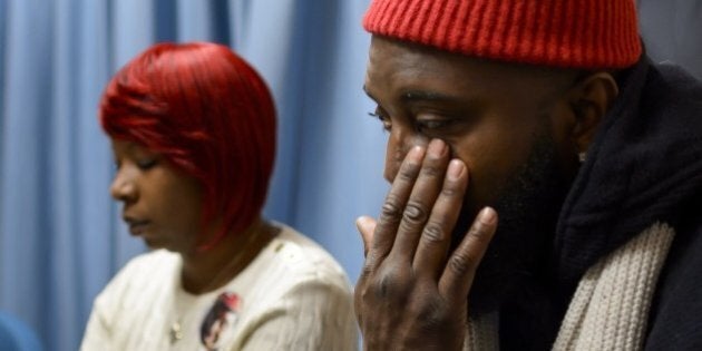Michael Brown Sr (R) and Lesley McSpadden, parents of the unarmed black teenager Michael Brown who was shot and killed by white police officer in Ferguson, Missouri last August attends a press conference on November 12, 2014 in Geneva after a session of the United Nations Committee against Torture (CAT). The CAT committee members slammed police brutality that appears to disproportionately affect minorities. AFP PHOTO / FABRICE COFFRINI (Photo credit should read FABRICE COFFRINI/AFP/Getty Images)