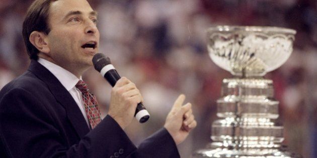 16 Jun 1998: NHL Commisioner Gary Bettman talks and points to the Stanley Cup Trophy during the Stanley Cup Finals game between the Detroit Red Wings and the Washington Capitals at the MCI Center in Washington, D. C.. The Red Wings defeated the Capitals 4-1.