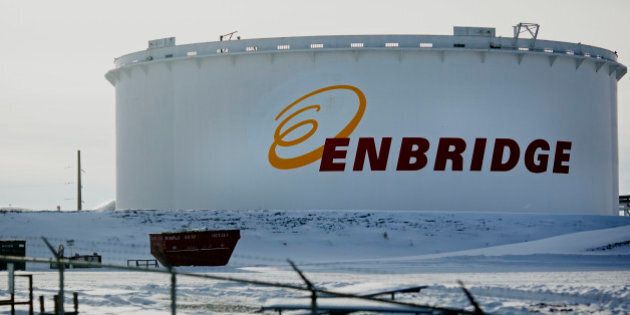 An Enbridge Inc. oil tank stands at the Hardisty tank farm in Hardisty, Alberta, Canada, on Saturday, Dec. 7, 2013. Canadian heavy crude reached its strongest level in more than two months on the spot market as a pipeline connection to the U.S. Gulf Coast began filling with crude ahead of its startup next month. Photographer: Brett Gundlock/Bloomberg via Getty Images