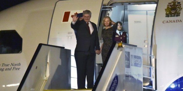 Canada's Prime Minister Stephen Harper and his wife Laureen arrive at the airport in Brisbane to take part in the G20 summit on November 14, 2014. Australia hosts the leaders of the world's 20 biggest economies for the G20 summit in Brisbane on November 15 and 16. AFP PHOTO / PETER PARKS (Photo credit should read PETER PARKS/AFP/Getty Images)