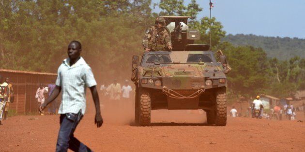 An armoured vehicle of the 13th Battalion of Chasseurs Alpins (13th BCA), part of the Sangaris forces, patrols in Bambari on April 19, 2014. In the nightmare of the strife-torn Central African Republic, many citizens have begun to long for the 'good old days' of Jean-Bedel Bokassa, the emperor who became infamous for his brutality yet worked economic wonders in their eyes. Some residents of the capital Bangui are openly nostalgic for the Bokassa era, which lasted from his military coup in 1966 until his overthrow in 1979, two years after a hugely extravagant coronation when the former soldier proclaimed himself emperor. AFP PHOTO / MIGUEL MEDINA (Photo credit should read MIGUEL MEDINA/AFP/Getty Images)