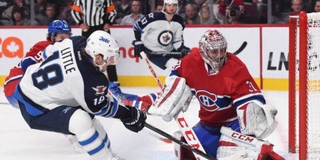 MONTREAL, QC - NOVEMBER 11: Carey Price #31 of the Montreal Canadiens makes a save off the shot by Bryan Little #18 of the Winnipeg Jets in the NHL game at the Bell Centre on November 11, 2014 in Montreal, Quebec, Canada. (Photo by Francois Lacasse/NHLI via Getty Images)