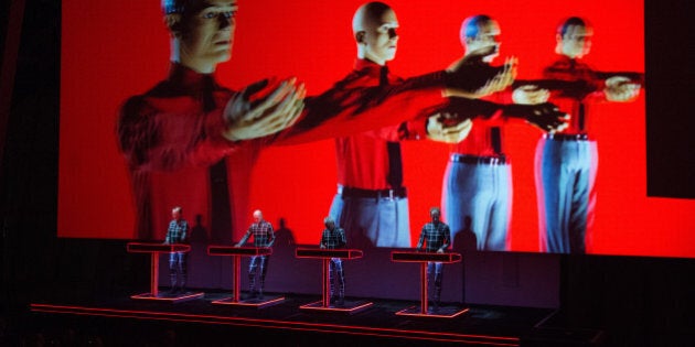 PARIS, FRANCE - NOVEMBER 06: Ralf Hutter, Fritz Hilpert, Henning Schmitz and Falk Grieffenhagen from Kraftwerk perform at Fondation Louis Vuitton on November 6, 2014 in Paris, France. (Photo by David Wolff - Patrick/Getty Images)