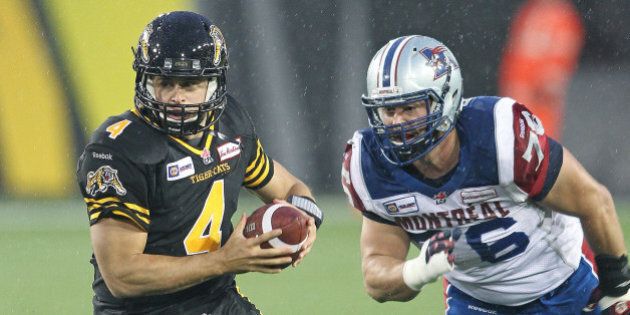 HAMILTON, ON - NOVEMBER 8: Zach Collaros #4 of the Hamilton Tiger-cats takes off with the ball against the Montreal Alouettes in a CFL football game at Tim Hortons Field on November 8, 2014 in Hamilton, Ontario, Canada. (Photo by Claus Andersen/Getty Images)
