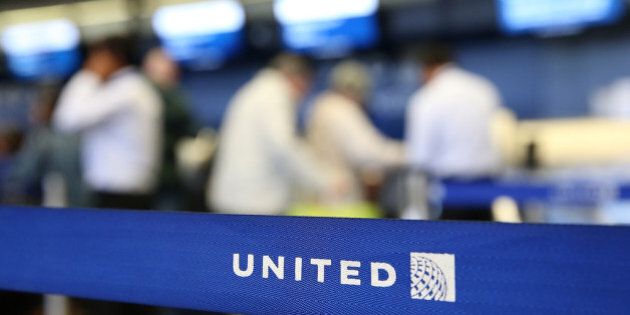 SAN FRANCISCO, CA - JULY 25: The United Airlines name is displayed on a barrier at San Francisco International Airport on July 25, 2013 in San Francisco, California. United Continental Holdings, the parent company of United Airlines, reported record revenues with second quarter earnings of $469 million. (Photo by Justin Sullivan/Getty Images)