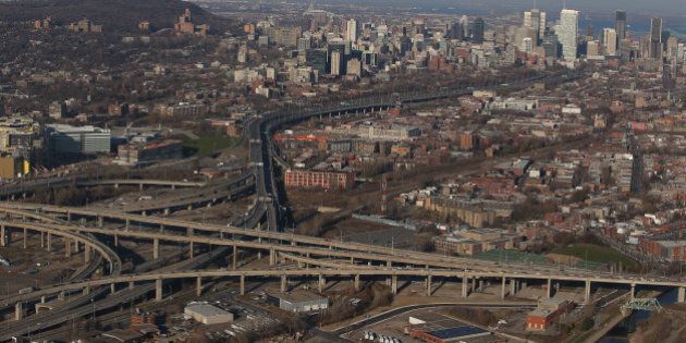 MONTREAL, QC - NOVEMBER 18: An aerial view of traffic on the Turcot Interchange and the Montreal skyline are seen from above on November 18, 2012 in Montreal, Quebec. (Photo by Tom Szczerbowski/Getty Images)