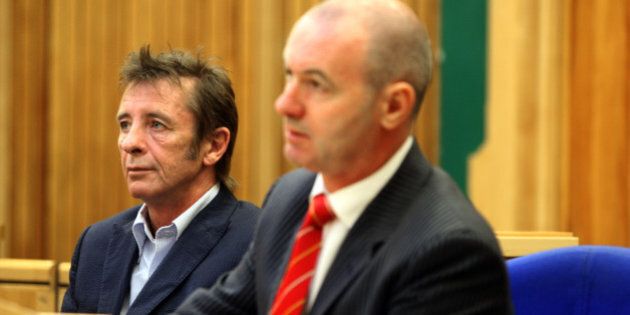 Phil Rudd, left, sits by his lawyer Craig Tuck during an appeal for his drug conviction inside the Tauranga District Court on march 31, 2011.