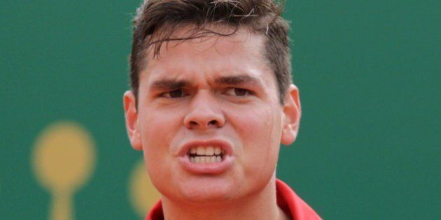 Canada's Milos Raonic reacts on April 18, 2014 during his Monte-Carlo ATP Masters Series Tournament tennis match against Switzerland's Stanislas Wawrinka in Monaco. AFP PHOTO / JEAN CHRISTOPHE MAGNENET (Photo credit should read JEAN-CHRISTOPHE MAGNENET/AFP/Getty Images)