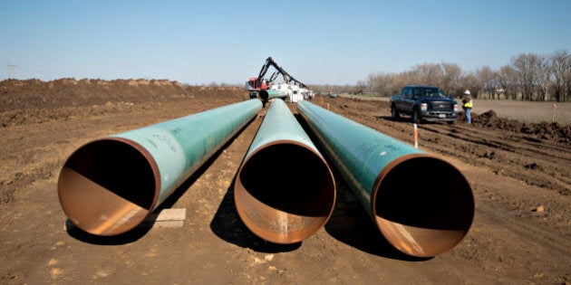 Three sections of pipe sit on the ground during construction of the Gulf Coast Project pipeline in Atoka, Oklahoma, U.S., on Monday, March 11, 2013. The Gulf Coast Project, a 485-mile crude oil pipeline being constructed by TransCanada Corp., is part of the Keystone XL Pipeline Project and will run from Cushing, Oklahoma to Nederland, Texas. Photographer: Daniel Acker/Bloomberg via Getty Images