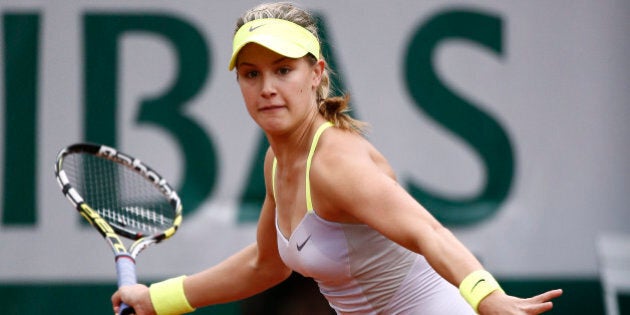 Canada's Eugenie Bouchard hits a forehand shot to Russia's Maria Sharapova during a French tennis Open second round match at the Roland Garros stadium in Paris on May 30, 2013. AFP PHOTO / MARTIN BUREAU (Photo credit should read MARTIN BUREAU/AFP/Getty Images)