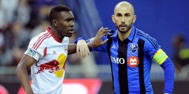 MONTREAL, QC - APRIL 5: Lloyd Sam #10 of the New York RedBulls defends against Marco Di Vaio #9 of the Montreal Impact during the MLS game at the Olympic Stadium on April 5, 2014 in Montreal, Quebec, Canada. (Photo by Richard Wolowicz/Getty Images)