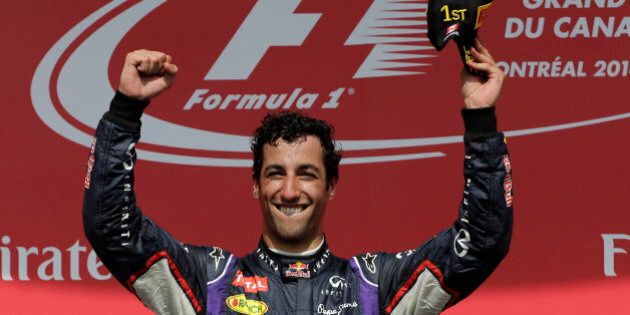 Red Bull driver Daniel Ricciardo, from Australia, celebrates after winning the Canadian Grand Prix Sunday, June 8, 2014, in Montreal. (AP Photo/David J. Phillip)