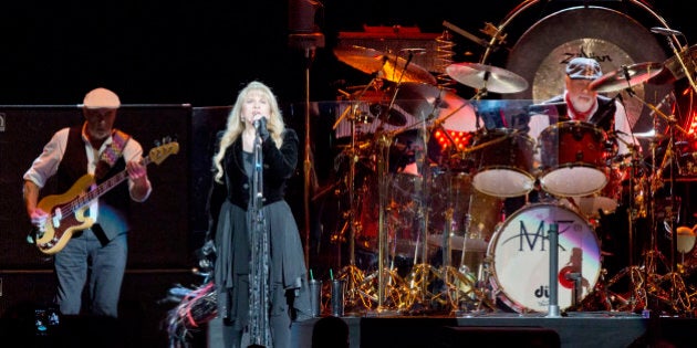 BERLIN, GERMANY - OCTOBER 16: John McVie, Stevie Nicks and Mick Fleetwood (L-R) of Fleetwood Mac perform live during a concert at the O2 World on October 16, 2013 in Berlin, Germany. (Photo by Frank Hoensch/Redferns via Getty Images)