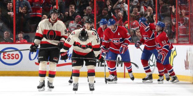 OTTAWA, ON - APRIL 4: Mika Zibanejad #93 and Zack Smith #15 of the Ottawa Senators react as Thomas Vanek #20, Andrei Markov #79, Max Pacioretty #67 and David Desharnais #51 of the Montreal Canadiens celebrate a first period goal at Canadian Tire Centre on April 4, 2014 in Ottawa, Ontario, Canada. (Photo by Andre Ringuette/NHLI via Getty Images)