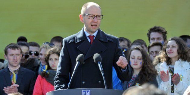 Ukraine's Prime Minister Arseniy Yatsenyuk delivers a speech during a convention of Batkivshchyna ('Fatherland') party in Kiev on March 29, 2014. Ukraine's controversial opposition leader, Yulia Tymoshenko, has formally joined the race to become the country's president, on the same day as the huge task facing the new leadership was underscored by a tough IMF aid package that will foist deep austerity on the country. AFP PHOTO / GENYA SAVILOV (Photo credit should read GENYA SAVILOV/AFP/Getty Images)