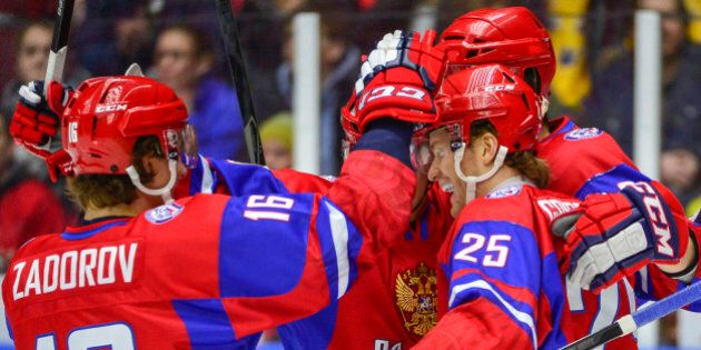 Russia's Mikhail Grigorenko, right no.25, celebrates scoring against Canada during the World Junior Hockey Championships bronze match at Malmo Arena in Malmo, Sweden on Sunday, Jan. 5, 2014. (AP Photo/TT News Agency, Ludvig Thunman) SWEDEN OUT