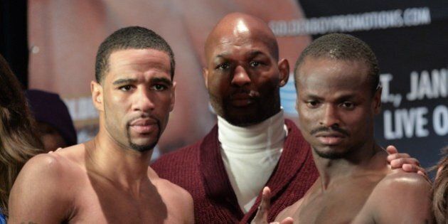US boxer Lamont Peterson(L) and Haitian-born Canadian Dierry Jean attend the weigh-in in Washington,DC on January 24, 2014, the eve of their IBF light welterweight championship fight on January 25. AFP PHOTO/Nicholas KAMM (Photo credit should read NICHOLAS KAMM/AFP/Getty Images)