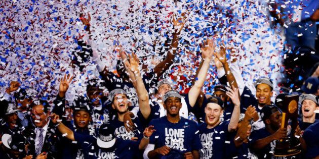 ARLINGTON, TX - APRIL 07: The Connecticut Huskies celebrate after defeating the Kentucky Wildcats 60-54 in the NCAA Men's Final Four Championship at AT&T Stadium on April 7, 2014 in Arlington, Texas. (Photo by Tom Pennington/Getty Images)