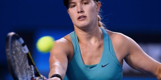 Canada's Eugenie Bouchard plays a shot during her women's singles match against Australia's Casey Dellacqua on day seven of the 2014 Australian Open tennis tournament in Melbourne on January 19, 2014. IMAGE RESTRICTED TO EDITORIAL USE - STRICTLY NO COMMERCIAL USE AFP PHOTO / WILLIAM WEST (Photo credit should read WILLIAM WEST/AFP/Getty Images)
