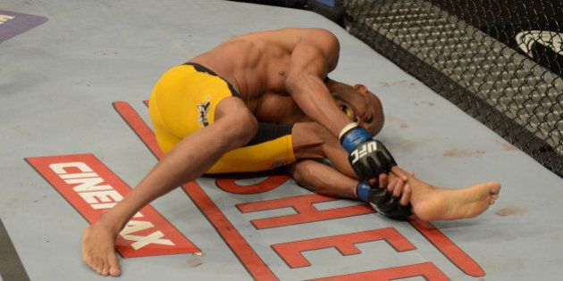 LAS VEGAS, NV - DECEMBER 28: Anderson Silva holds his leg in pain during the UFC middleweight championship bout during the UFC 168 event at the MGM Grand Garden Arena on December 28, 2013 in Las Vegas, Nevada. (Photo by Donald Miralle/Zuffa LLC/Zuffa LLC via Getty Images)