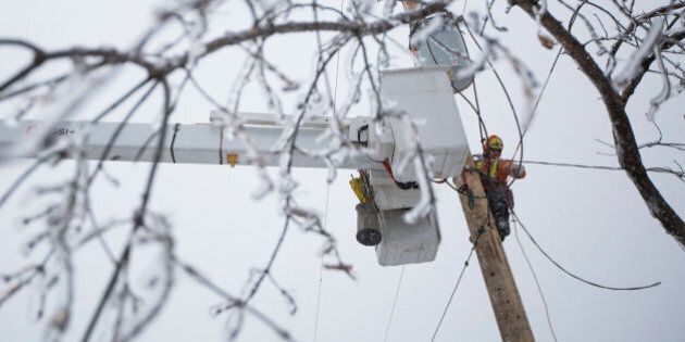 SCARBOROUGH, ON - DECEMBER 25 - Ben Brown from Sault Ste. Marie flew to Toronto to help restore power on Christmas Day to households in Scarborough that have been without electricity since a major ice storm struck Toronto. December 25, 2013. (Randy Risling/Toronto Star via Getty Images)