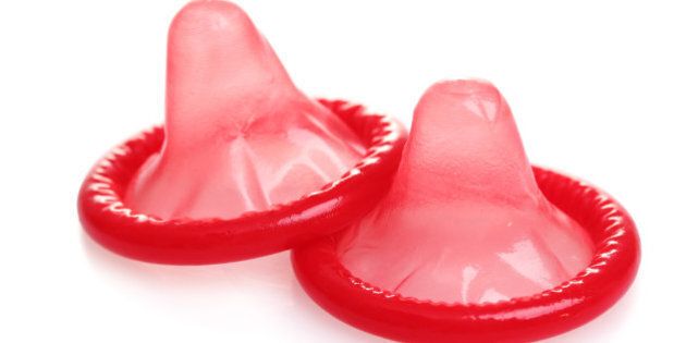 red condoms isolated on white