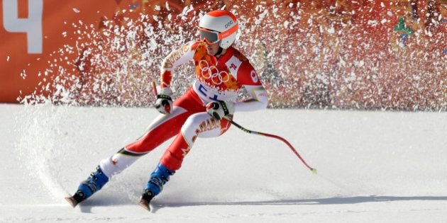 Canada's Marie-Michele Gagnon comes to a halt at the end of the downhill portion of the women's supercombined at the Sochi 2014 Winter Olympics, Monday, Feb. 10, 2014, in Krasnaya Polyana, Russia. (AP Photo/Gero Breloer)