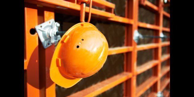 construction hardhat over wall...