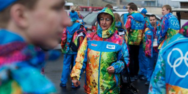 Olympic volunteers arrive at the Olympic Park ahead of the 2014 Winter Olympics, Wednesday, Jan. 29, 2014, in Sochi, Russia. (AP Photo/Pavel Golovkin)