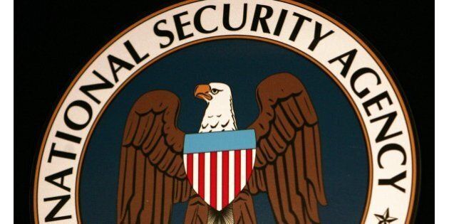 Fort Meade, UNITED STATES: The logo of the National Security Agency (NSA) hangs at the Threat Operations Center inside the NSA in the Washington suburb of Fort Meade, Maryland, 25 January 2006. US President George W. Bush delivered a speech behind closed doors and met with employees in advance of Senate hearings on the much-criticized domestic surveillance. AFP PHOTO/Paul J. RICHARDS (Photo credit should read PAUL J. RICHARDS/AFP/Getty Images)