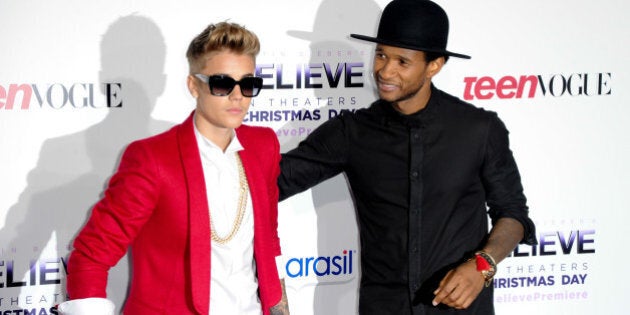 LOS ANGELES, CA - DECEMBER 18: Recording artists Justin Bieber and Usher attend the premiere of Open Road Films' 'Justin Bieber's Believe' at Regal Cinemas L.A. Live on December 18, 2013 in Los Angeles, California. (Photo by Allen Berezovsky/Getty Images)