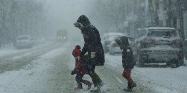 TORONTO, ON - MARCH 12: Another snow storm hits the GTA, as people struggling to get around the city. Toronto, March 12, 2014. (Randy Risling/Toronto Star via Getty Images)