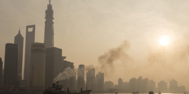 SHANGHAI, CHINA - DECEMBER 25: (CHINA OUT) Ships sail up the Huangpu River as heavy smog engulfs the city on December 25, 2013 in Shanghai, China. Heavy smog covered many parts of China on Christmas Eve, worsening air pollution. (Photo by ChinaFotoPress/Getty Images)