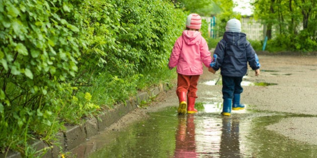 boy and girl in the puddle