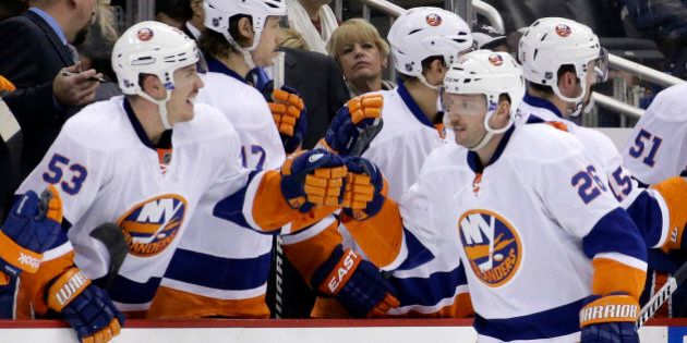 New York Islanders' Thomas Vanek (26) celebrates the first of his two second-period goals with teammate Casey Cizikas (53) during an NHL hockey game against the Pittsburgh Penguins in Pittsburgh Friday, Nov. 22, 2013. (AP Photo/Gene J. Puskar)