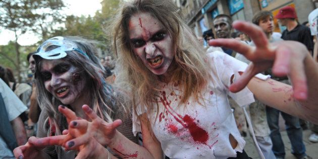 People dressed up as zombies take part in a Zombie Walk on October 20, 2012 in Belgrade. AFP PHOTO/ ANDREJ ISAKOVIC (Photo credit should read ANDREJ ISAKOVIC/AFP/Getty Images)