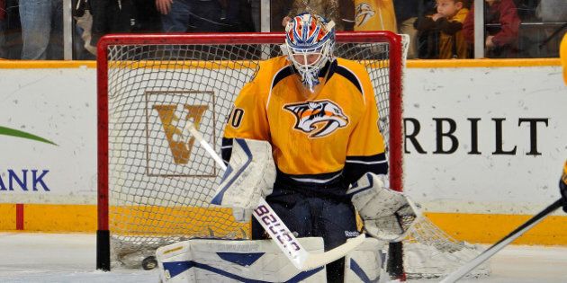 NASHVILLE, TN - JANUARY 18: In his first game as a member of the Nashville Predators goalie Devan Dubnyk #40 warms up prior to a game against the Colorado Avalanche at Bridgestone Arena on January 18, 2014 in Nashville, Tennessee. (Photo by Frederick Breedon/Getty Images)
