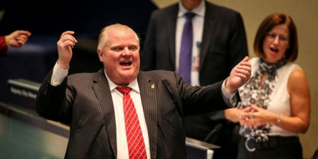TORONTO, ON- DECEMBER 17 - Mayor Rob Ford dances to a live Reggae version of Merry Christmas performed by Jay Douglas during a break in the council meeting in Toronto December 17, 2013. (David Cooper/Toronto Star via Getty Images)