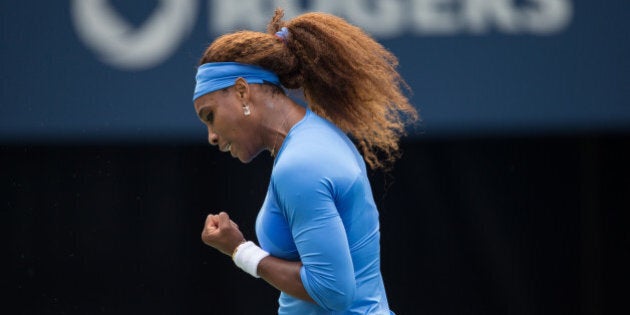 Serena Williams of the United States celebrates a point during the final of the Rogers Cup against Sorana Cirstea of Romania at Rexall Centre at York University in Toronto, Ontario, Canada on August 11, 2013. AFP PHOTO/Geoff Robins (Photo credit should read GEOFF ROBINS/AFP/Getty Images)